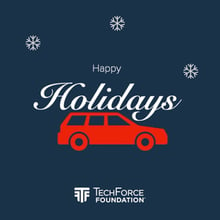 A red clip-art car on a dark blue background, with the words 'Happy Holidays from TechForce Foundation' styled in white lettering to look like a tree on top of the car.